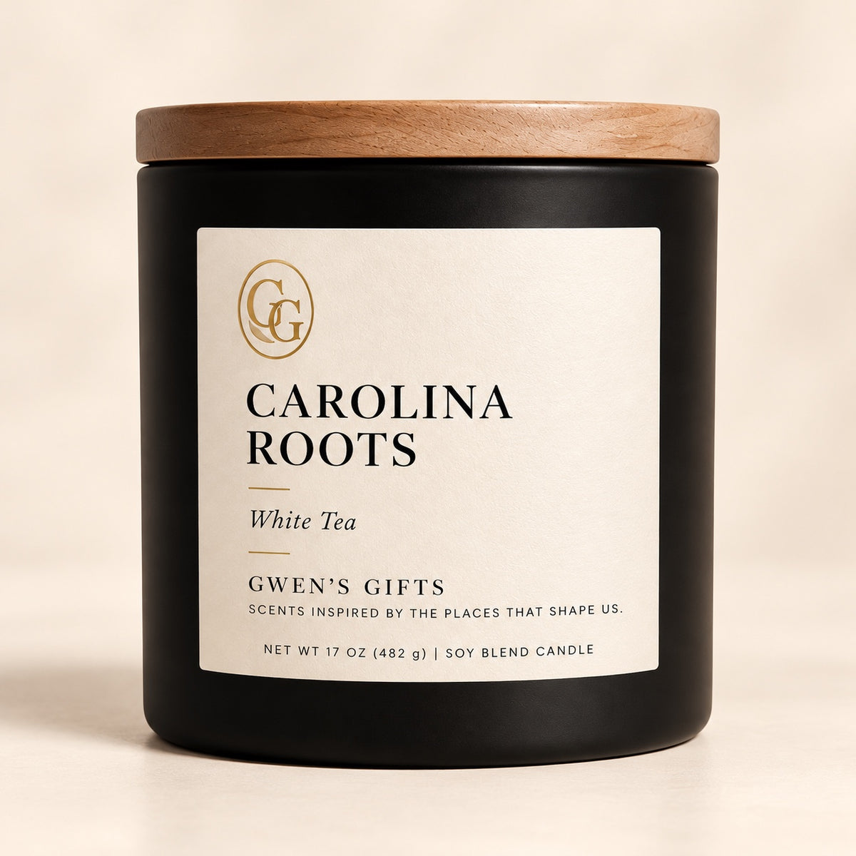 Carolina Roots candle, White Tea, in a matte black vessel with a natural wood lid