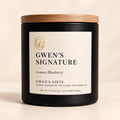 Gwen’s Signature candle, Lemon Blueberry, in a matte black vessel with a natural wood lid