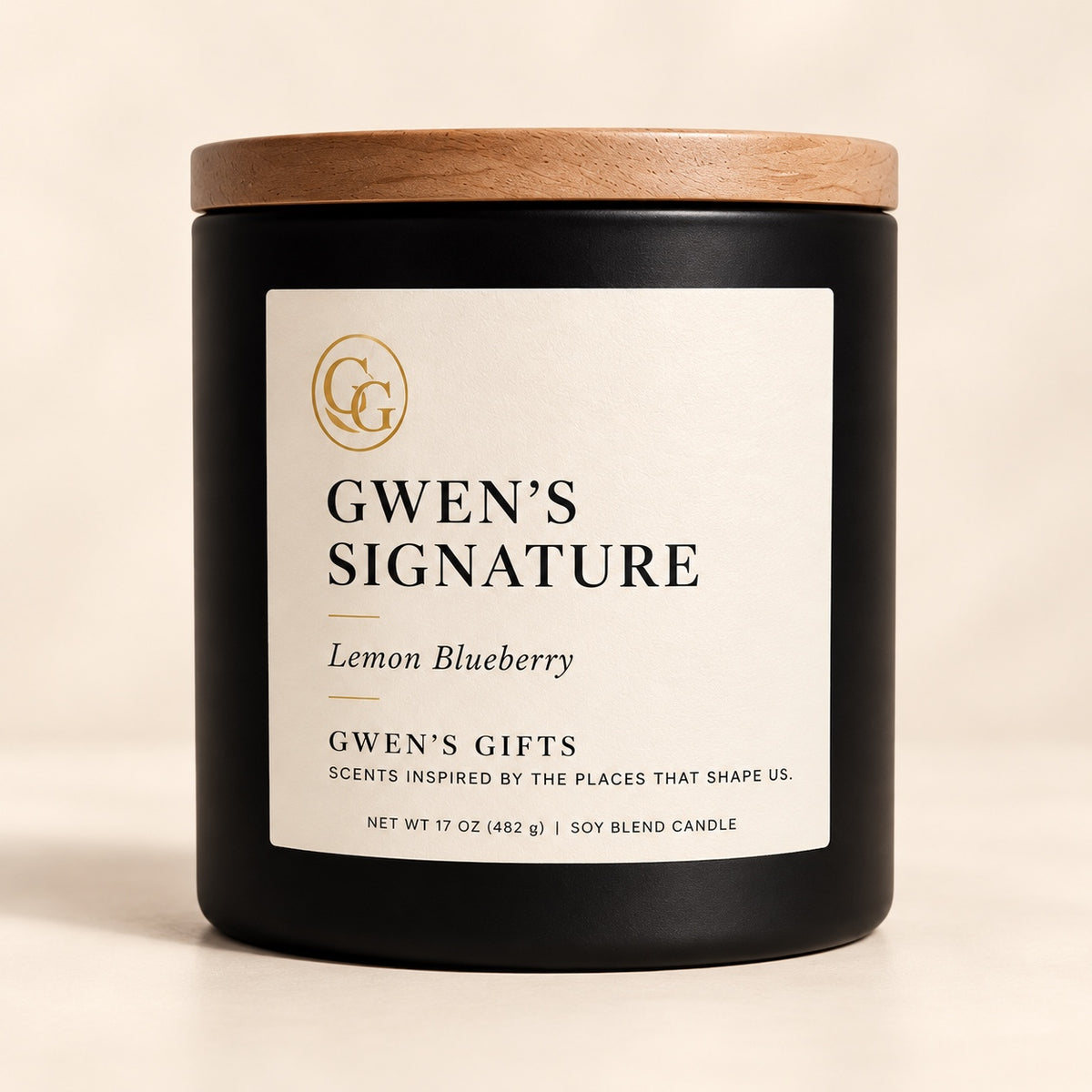 Gwen’s Signature candle, Lemon Blueberry, in a matte black vessel with a natural wood lid